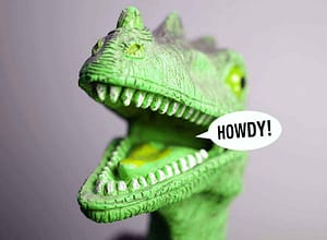 blog with head of bright green toy dinosaur with open mouth open