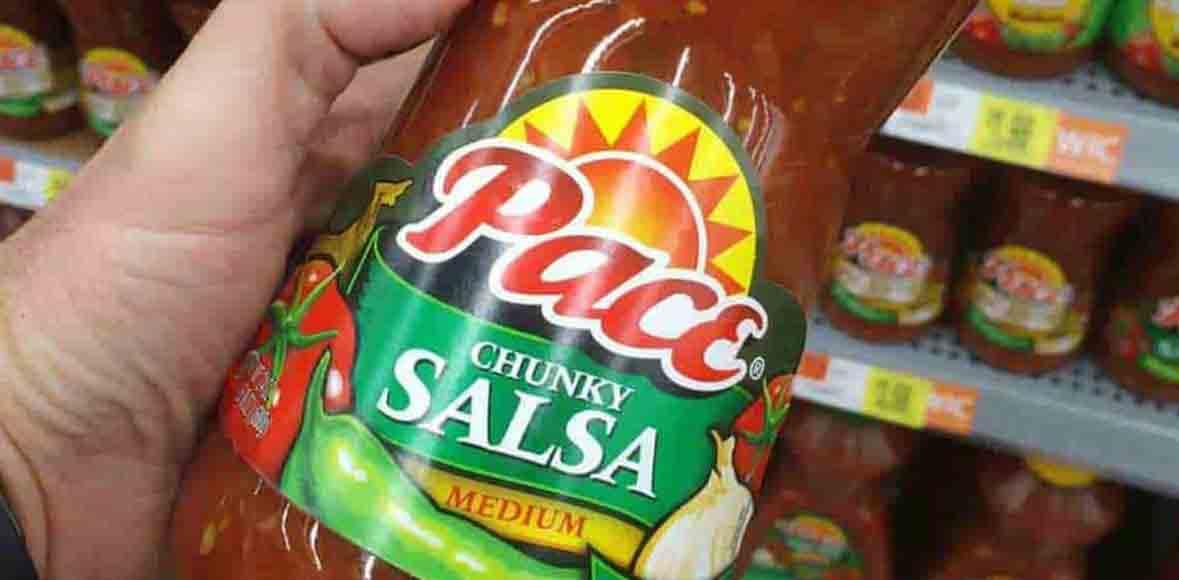 blog man holding bottle of pace brand salsa